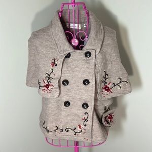 Woman’s fall capelet sweater